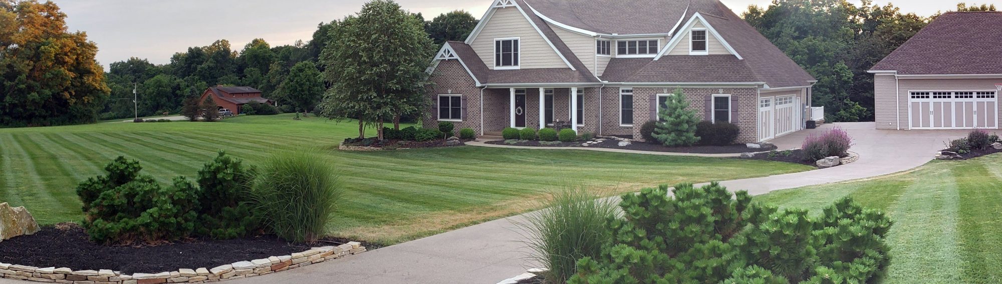 QLC-maintained lawn and landscaping surrounding an Ohio home